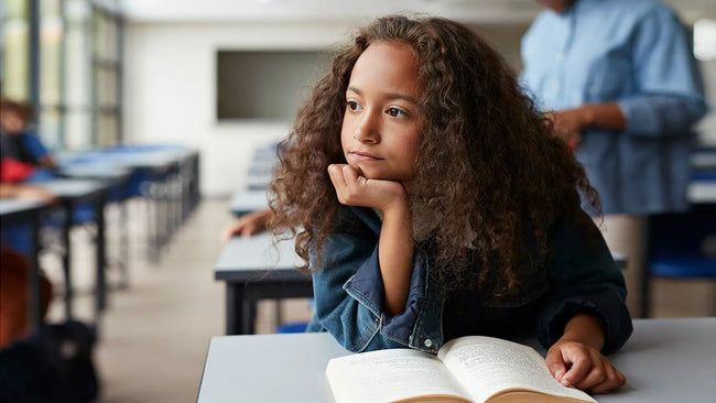 A girl child in a classroom