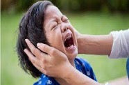 A child crying because his eyes are hurt