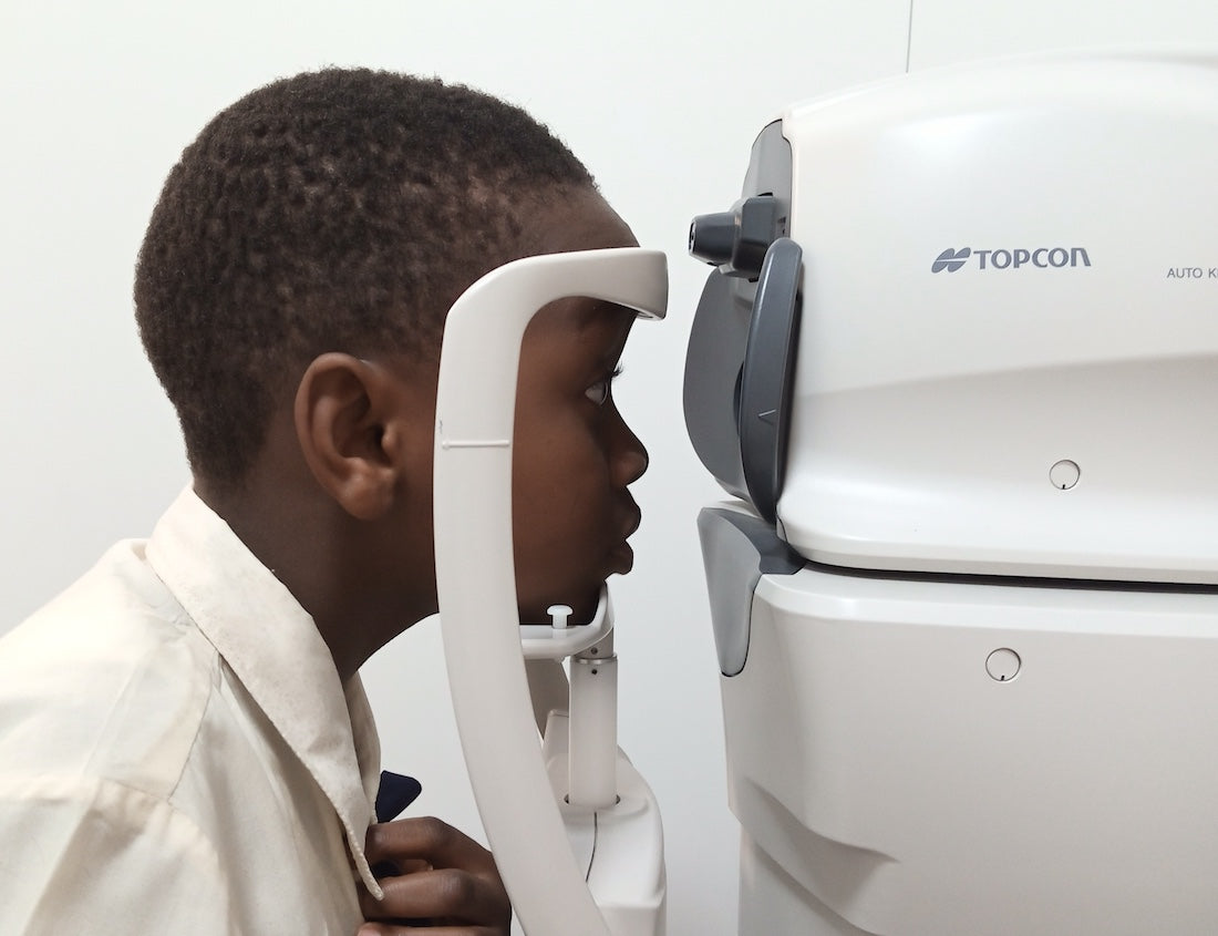 Optometrist performing Tonometer test on Child  | SpecSMART Eye Clinic Ikeja