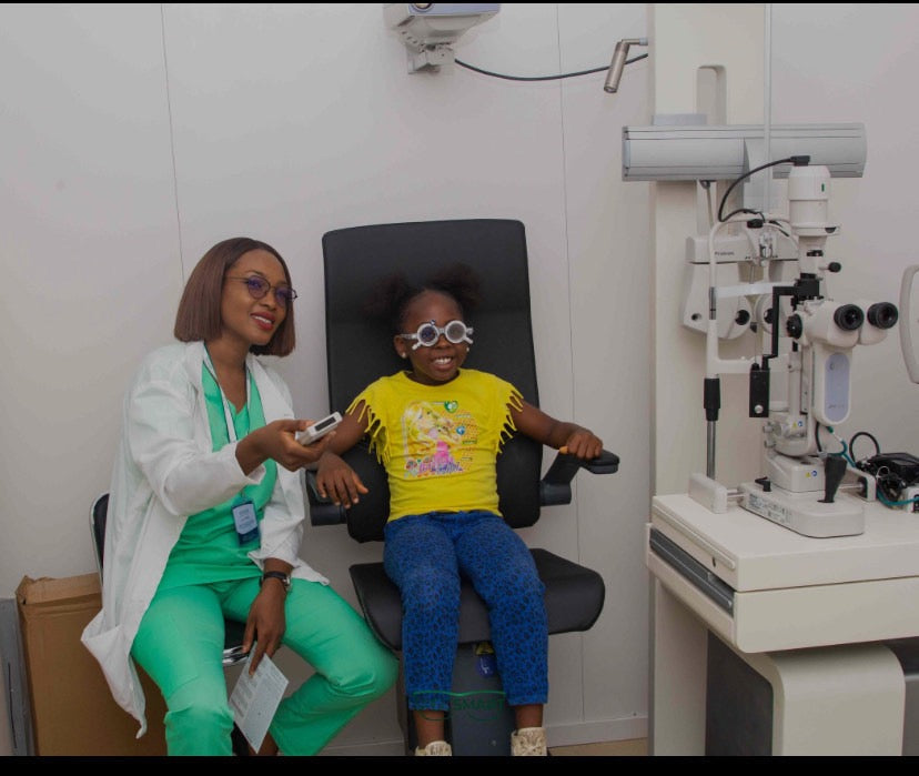 Optometrist with Child during an Eye test| SpecSMART Eye Clinic Ikoyi