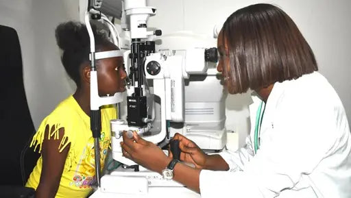 An Optometrist with a patient undergoing an eye test| SpecSMART Eye Clinic Ikeja