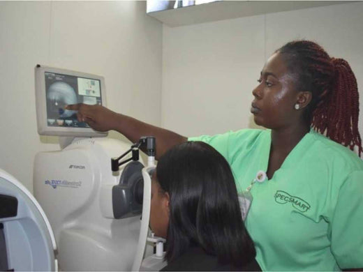 Optometrist and a patient undergoing an eye test| SpecSMART Eye Clinic Ikoyi