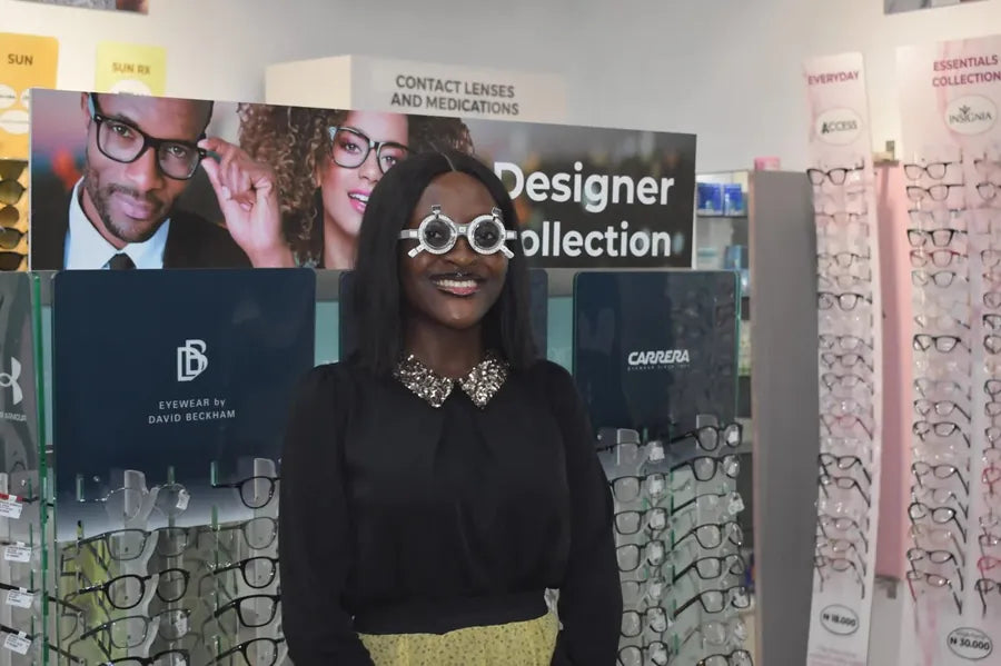 Smiling woman trying on trial Lens at SpecSMART