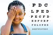  Young girl covering one eye during a vision screening with an eye chart in the background| SpecSMART Eye Clinic Ikoyi