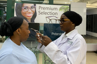 Optician Ikoyi fitting frame on patient 2