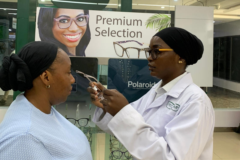 Optician Ikoyi fitting frame on patient 2
