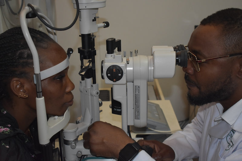 Optometrist performing slit lamp test Ikeja