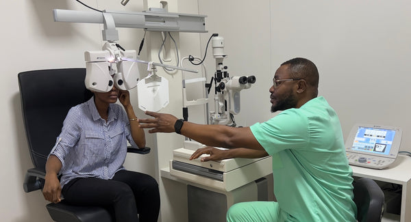 SpecSMART Eye Clinic Ikeja Optometrist 
Doing refraction test with female
patient