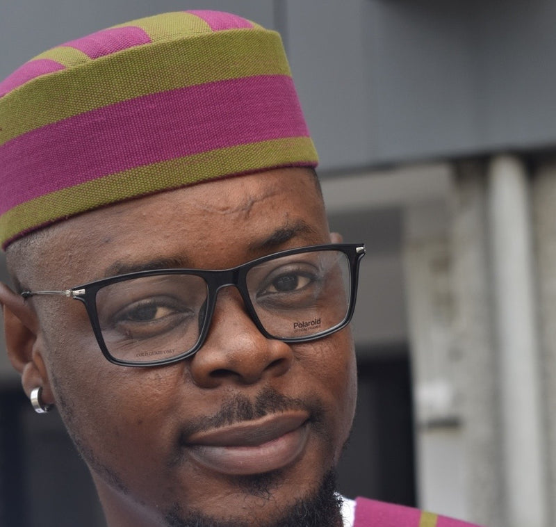 man wearing polaroid frames 